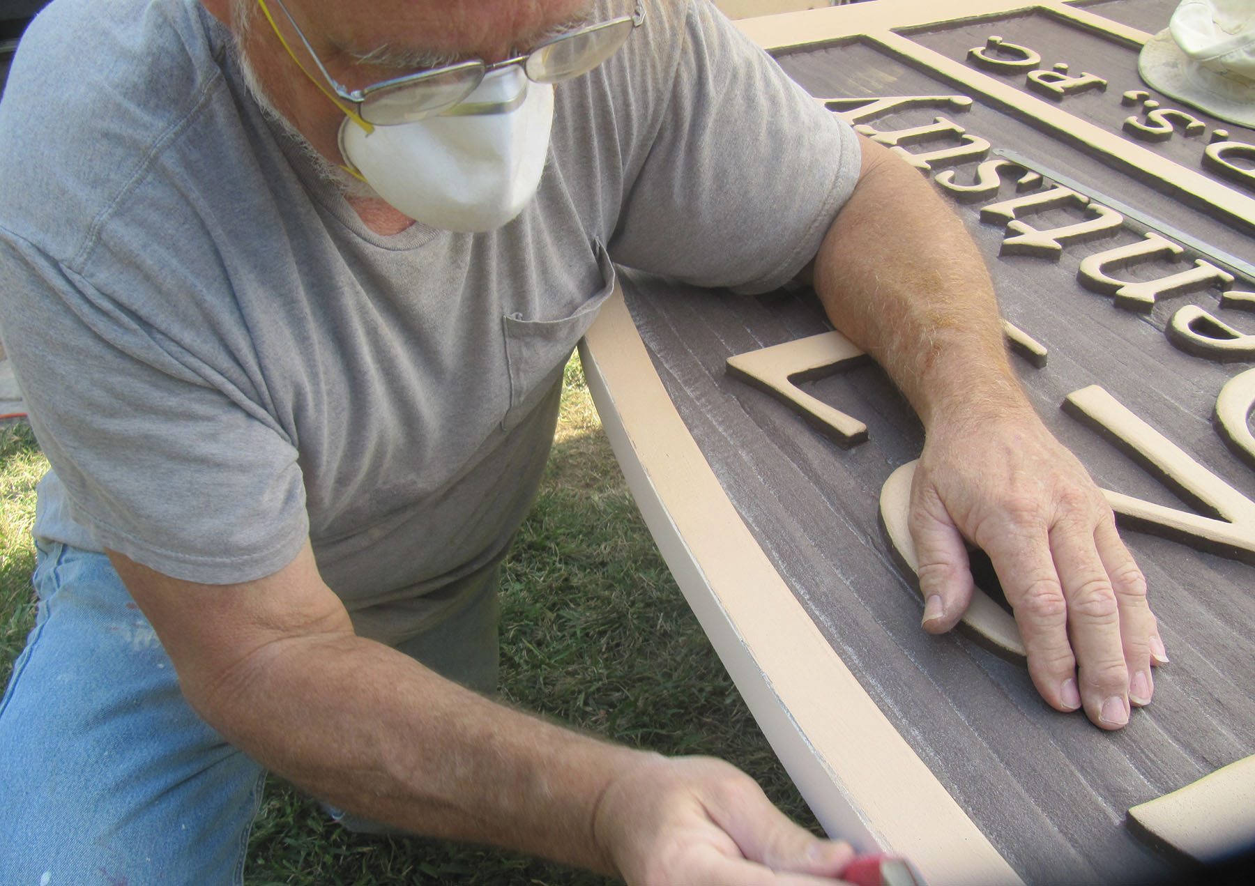 photo 09 Mark sanding the top of the sign